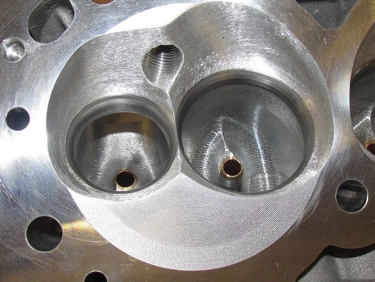 Dart head chamber after porting
